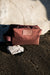 Modern, lightweight and eco-friendly unisex cosmetic bag. Ideal to store your beauty essentials for a weekend away or daily to the gym. It is generously sized, robust and yet flexible enough to store inside a carry on or a weekender. Made of recycled polyester from post-consumer waste. Burgundy
